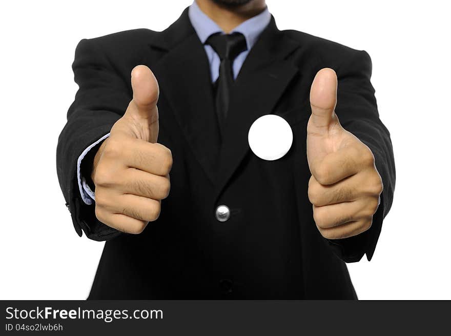 Man with black business suit with blank pinned button give thumb up. You can put your design on the button. Election day background or concept. Man with black business suit with blank pinned button give thumb up. You can put your design on the button. Election day background or concept