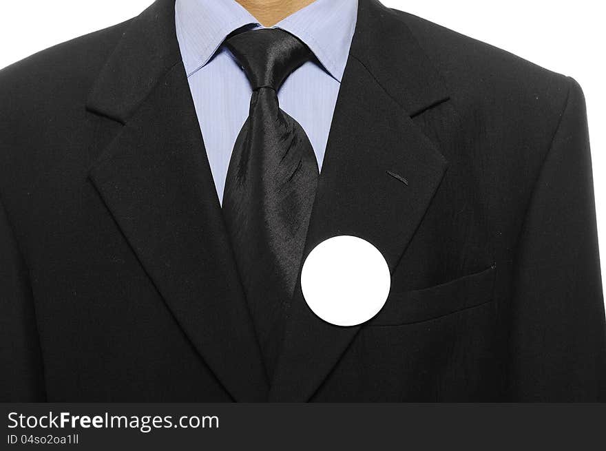 Man with black business suit with blank pinned button. You can put your design on the button. Election day background or concept. Man with black business suit with blank pinned button. You can put your design on the button. Election day background or concept