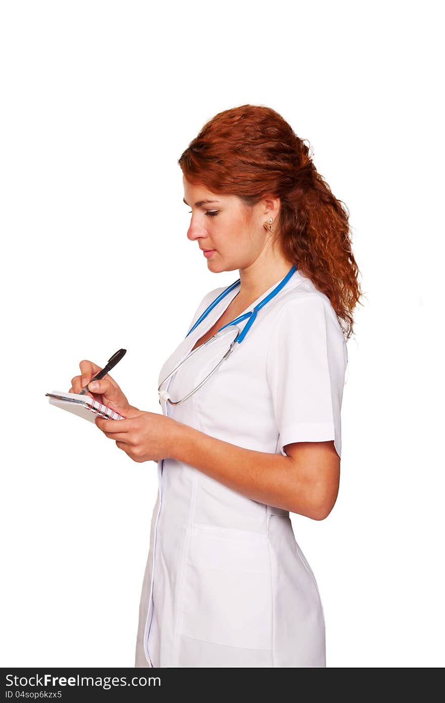 Beautiful young woman doctor listening  to the patient intently and writing something in notebook. Isolated on white background with clipping paths.