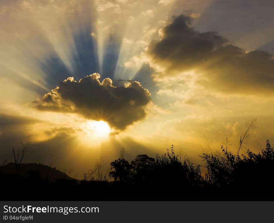 Image of sun shine through rain cloud. Image of sun shine through rain cloud