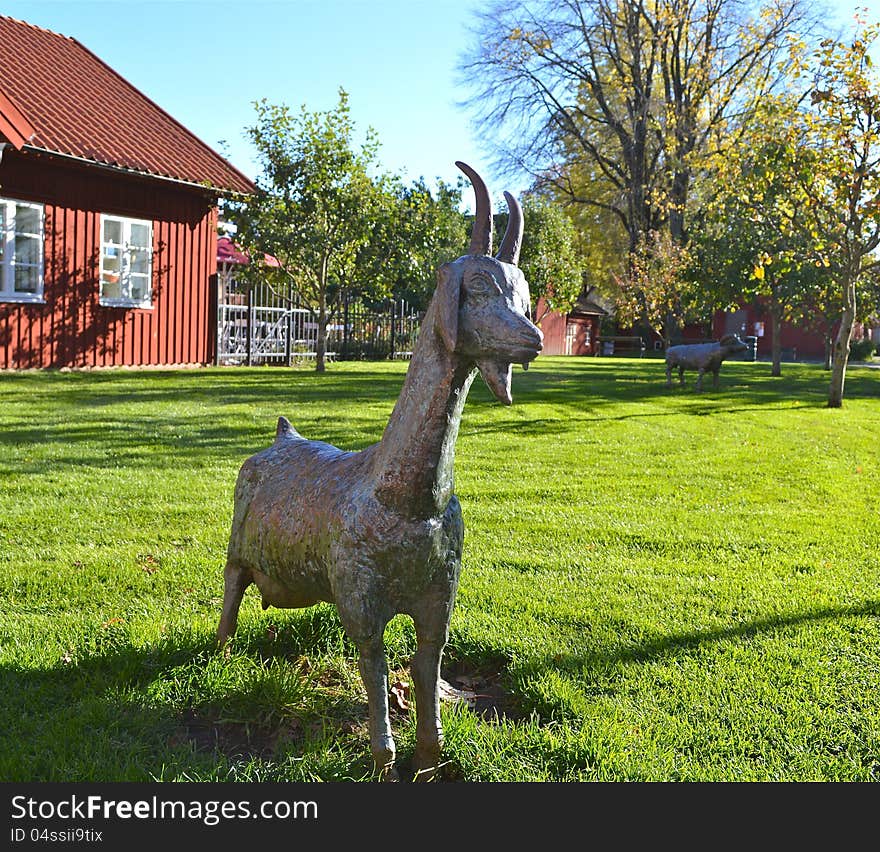 Goat made of stone standing in the park