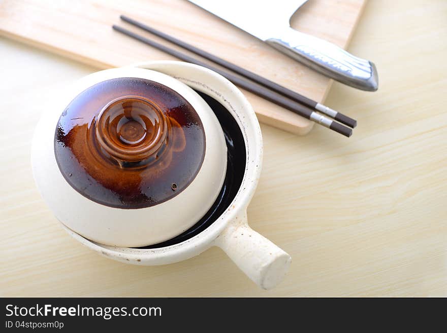 Topview Of Chinese Clay Pot With Chopsticks