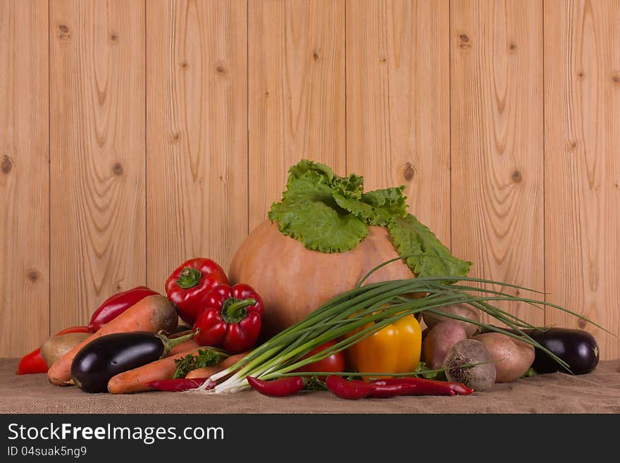 Pumpkin and fresh autumn vegetables gathered from the garden