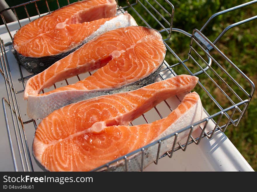 Pieces of salmon for cooking steaks on the grill. Pieces of salmon for cooking steaks on the grill