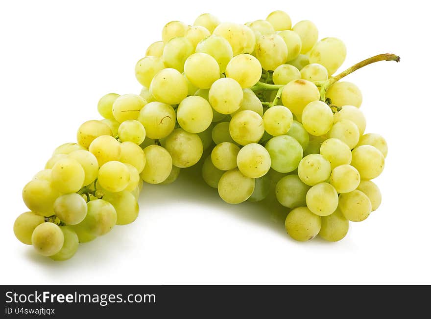 Fresh green grapes close up on the white