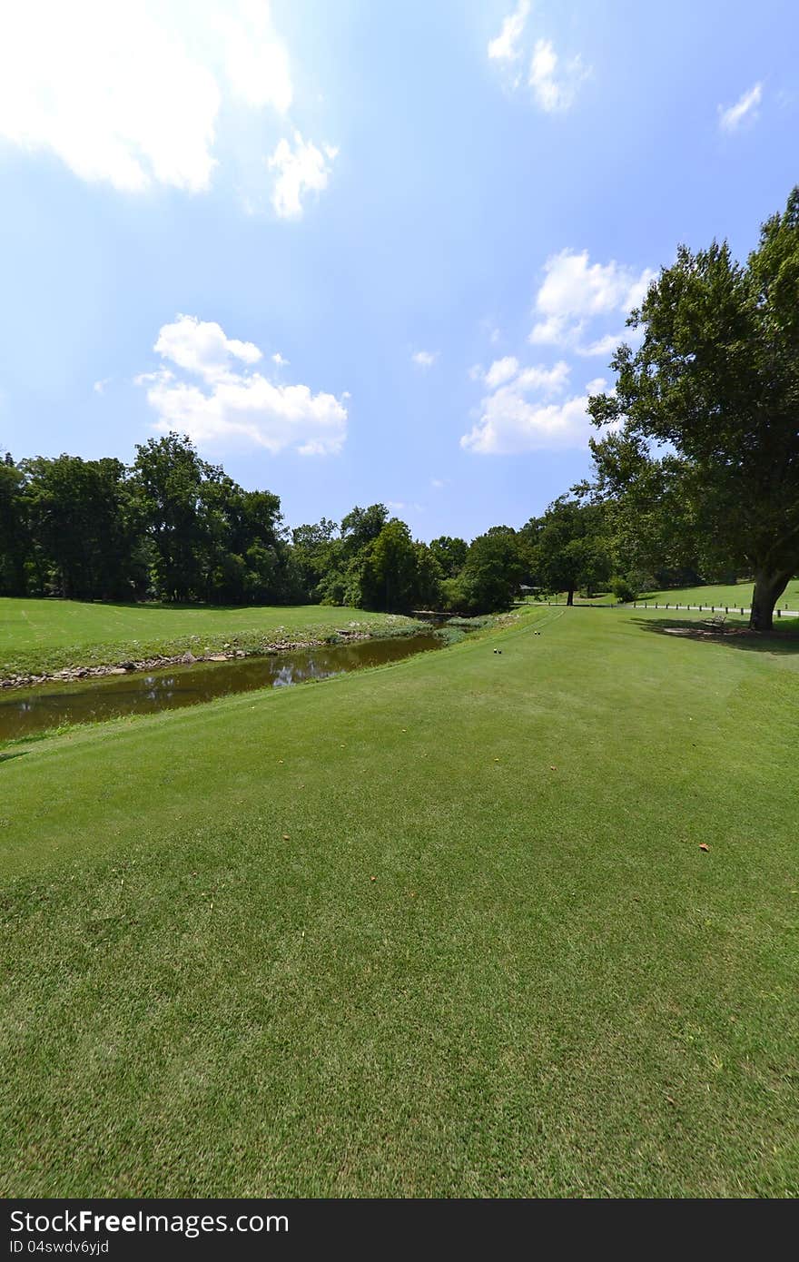 Beautifully maintained golf green during the summertime. Beautifully maintained golf green during the summertime