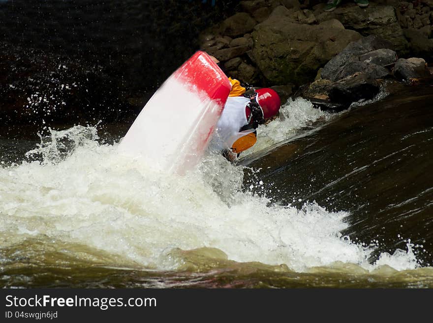 A contestant flips during a kayak competition on the Pigeon River. A contestant flips during a kayak competition on the Pigeon River.