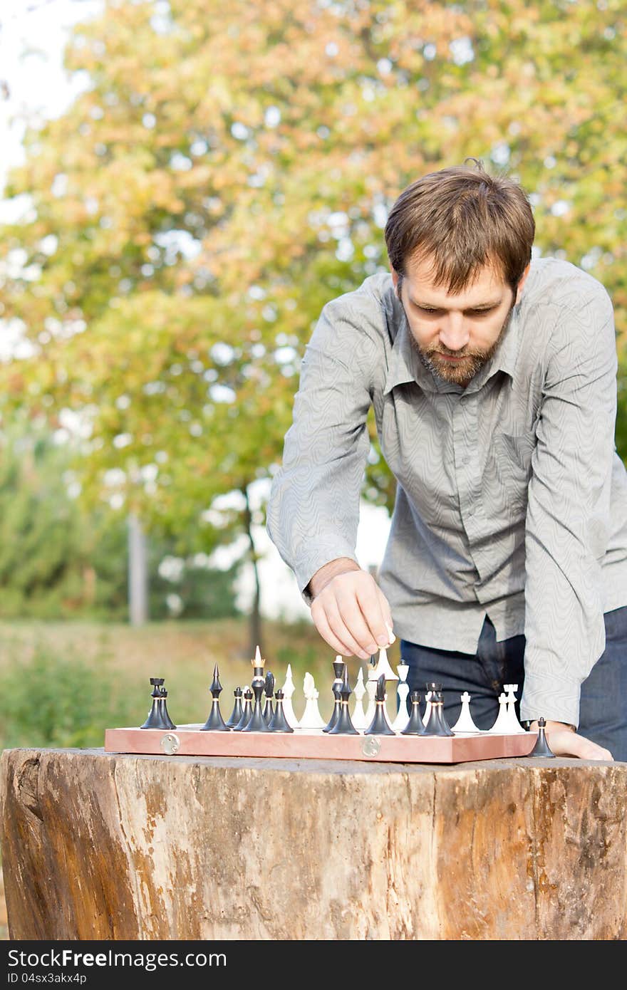 Man playing chess outdoors