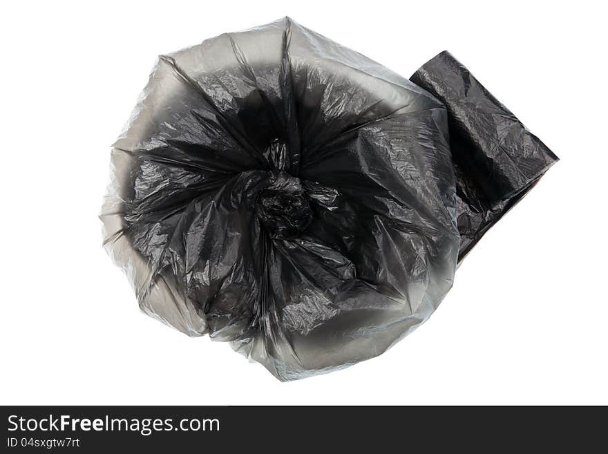 Unpacked roll of black plastic garbage bags isolated on white