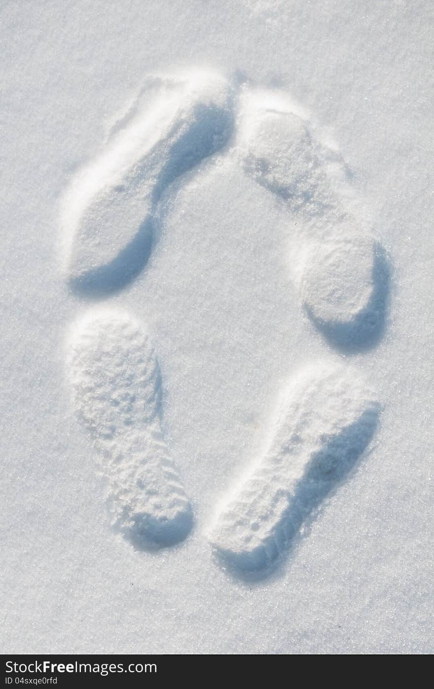 Traces Of Men And Women In The Snow