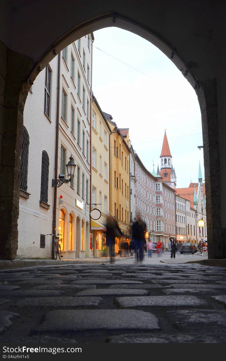 Blurred People On A Cobbled European Shopping Street