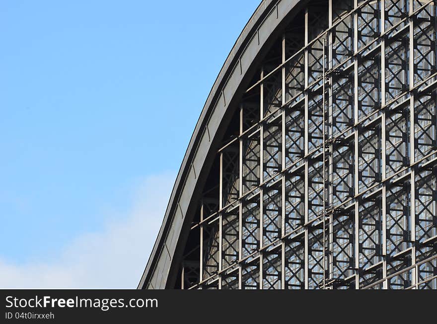 The steel structure gable of the Hamburg Dammtor railway station is seen against the light blue sky. The steel structure gable of the Hamburg Dammtor railway station is seen against the light blue sky