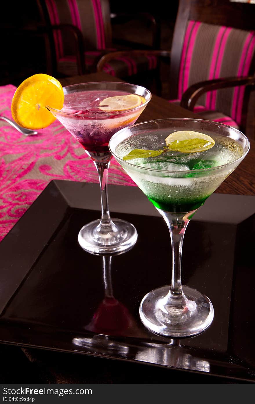 Romantic and colorful Martini cocktails with lemon and ice. Romantic and colorful Martini cocktails with lemon and ice