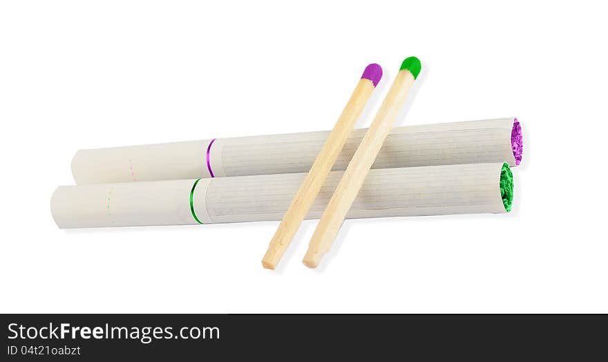 Two cigarettes with colored tobacco leafs and two matches with colored tips in purple and green. Two cigarettes with colored tobacco leafs and two matches with colored tips in purple and green