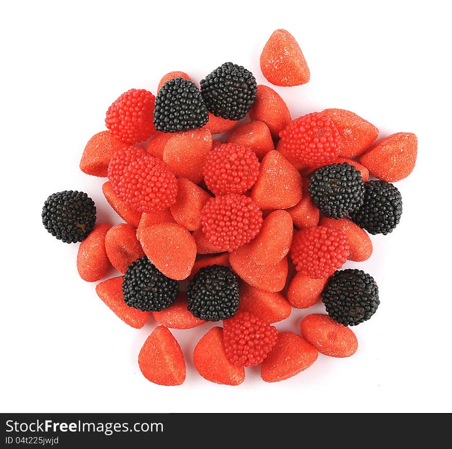 Assortment of black and red candies isolated on a white background