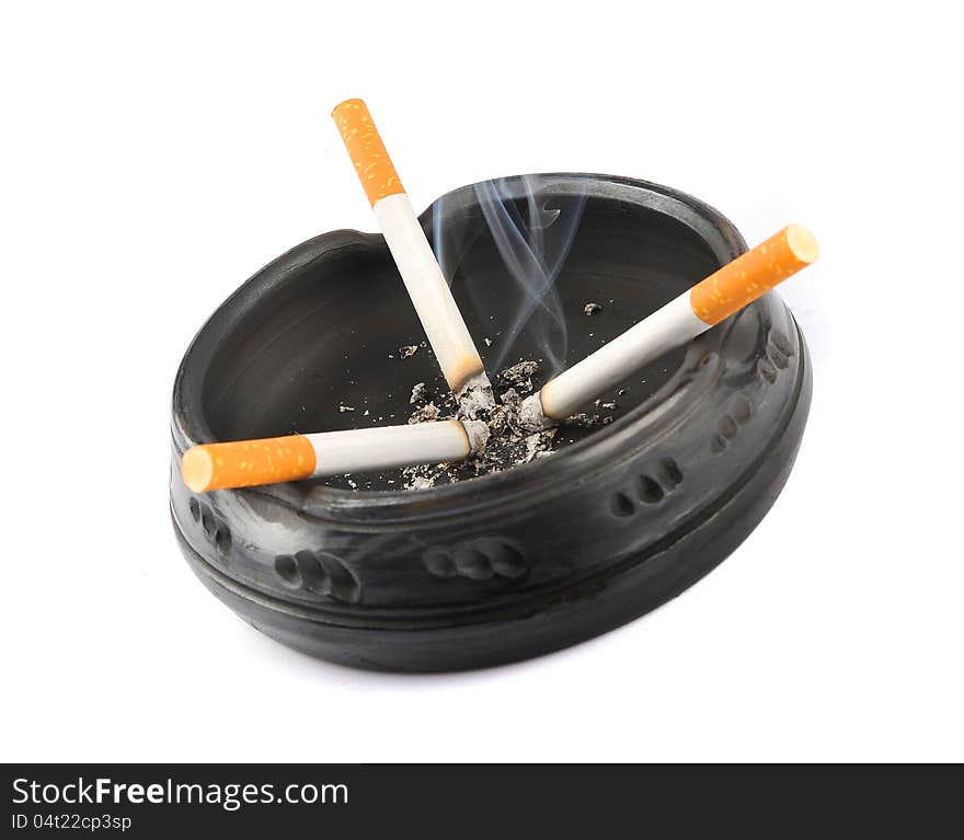 Three Lit Cigarettes in a Black Ashtray