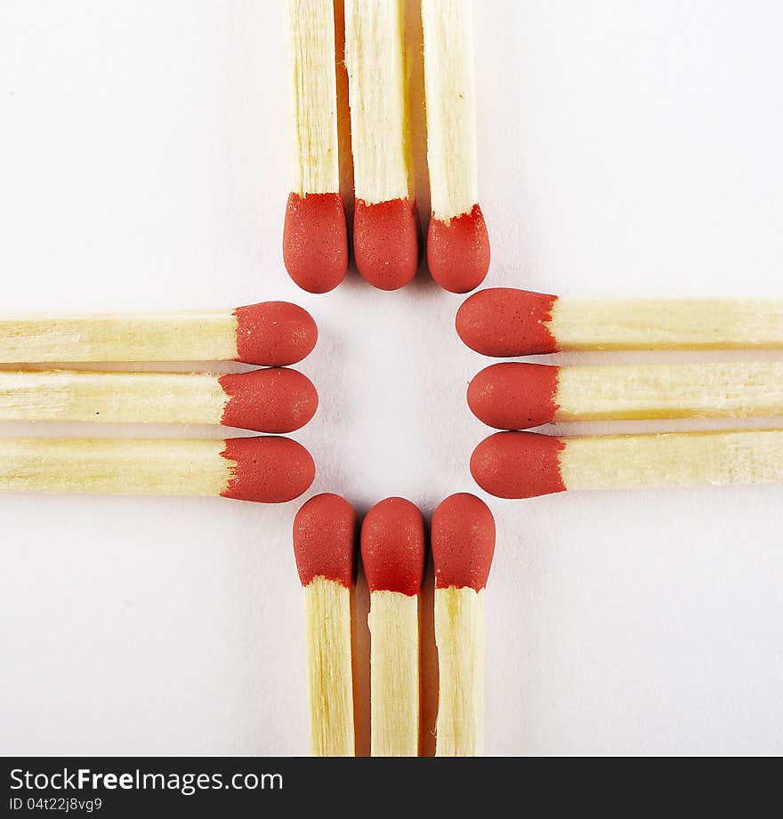 Close up of matches, arranged three on cross