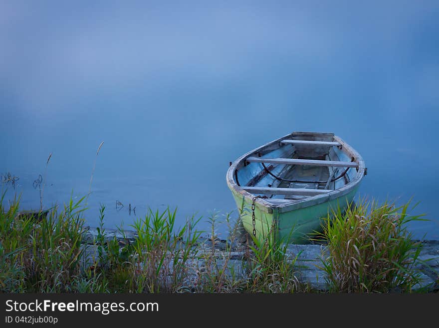 Fishing boat on the bank of the Katun River, October, Siberia. Fishing boat on the bank of the Katun River, October, Siberia.