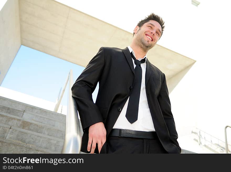 Portrait of a handsome young businessman smiling. Portrait of a handsome young businessman smiling