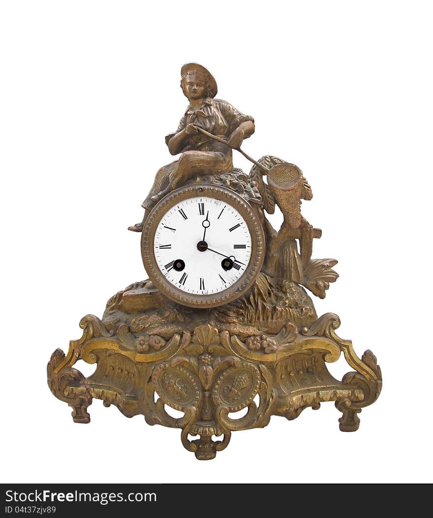 Antique fancy brass table clock isolated