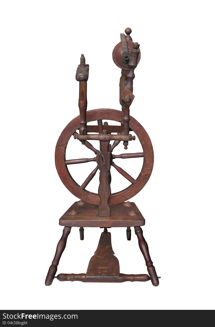 Small fancy antique wooden spinning wheel. Isolated on white. Small fancy antique wooden spinning wheel. Isolated on white.