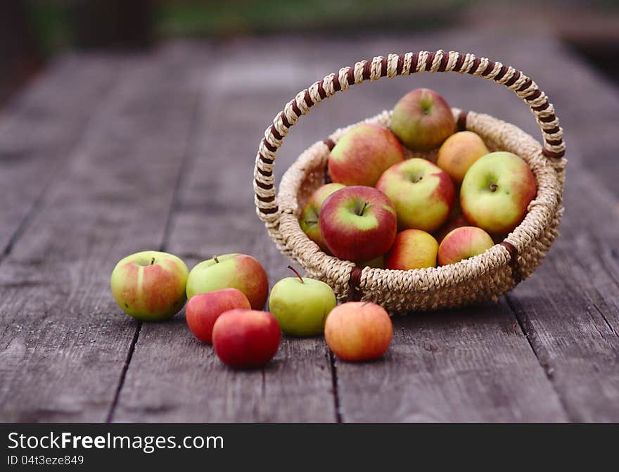 Apples in the Basket on the wooden table