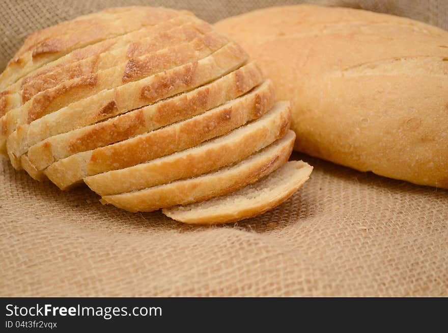 Fresh sliced bread on burlap