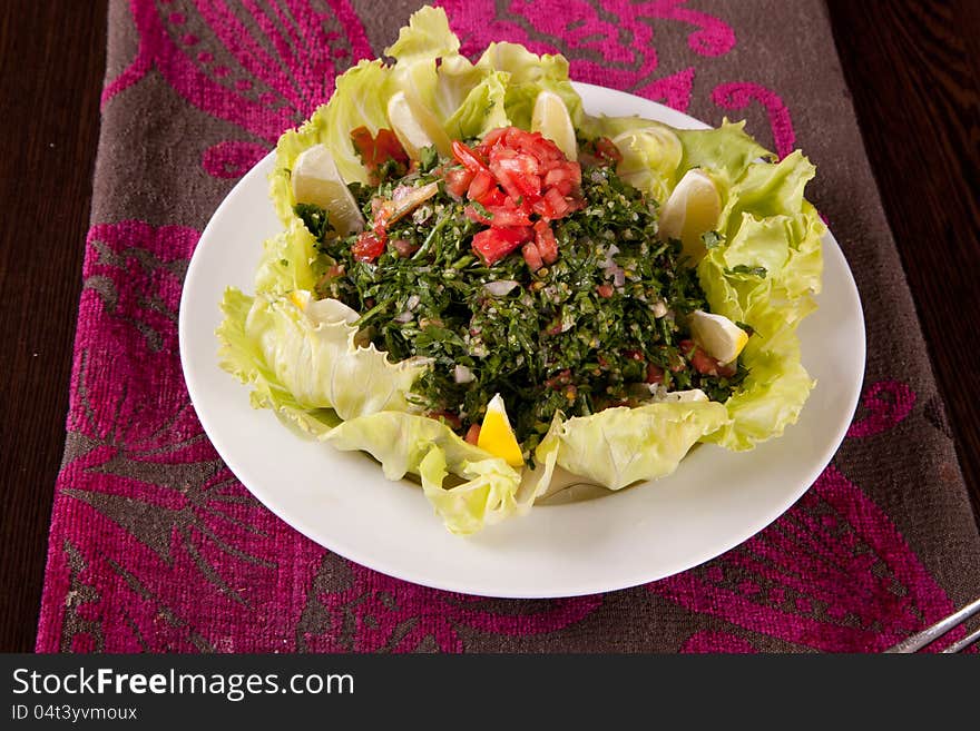 Salad with mixed lettuce, ham, olives, Lemon, avocado, cherry tomatoes, and a creamy dressing. Salad with mixed lettuce, ham, olives, Lemon, avocado, cherry tomatoes, and a creamy dressing.