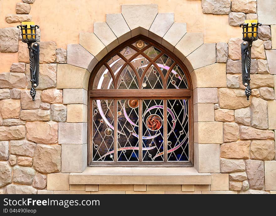 Arched window in stone wall