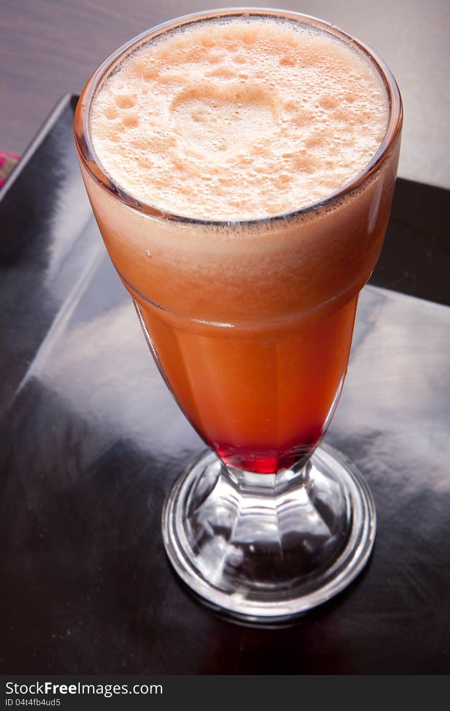 Fresh juice in glass on Black dish. symbol of a healthy lifestyle