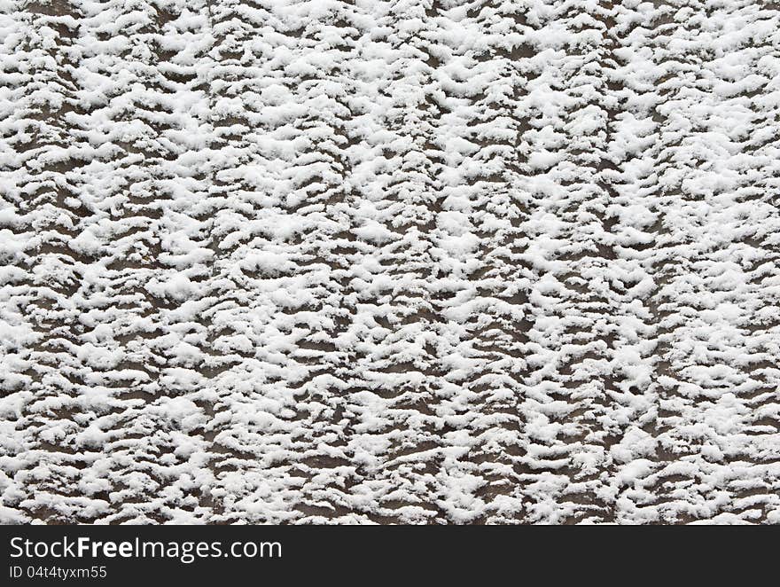 Slate roof covered with thawing snow. Slate roof covered with thawing snow