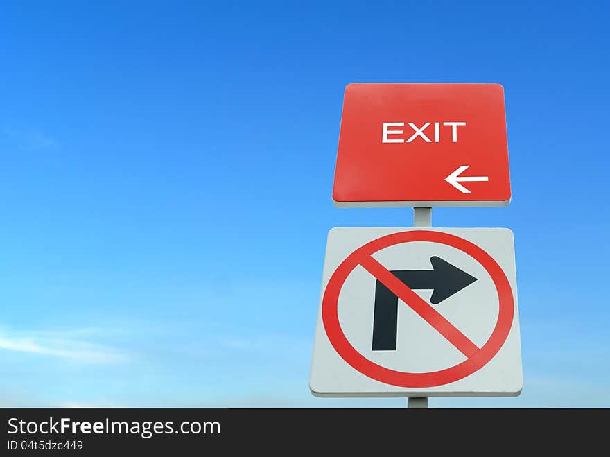 Red and white traffic sign in blue sky