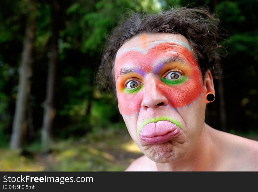 Indian Wearing Face Paint Showing His Tongue