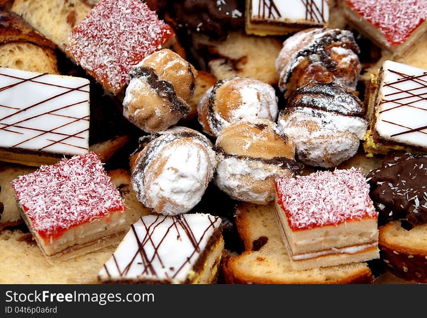 Different type of cakes arranged on plateau