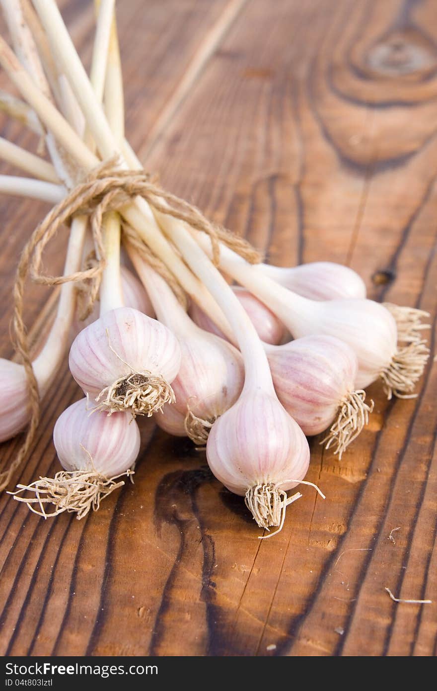 Beam Of Garlic On Wood