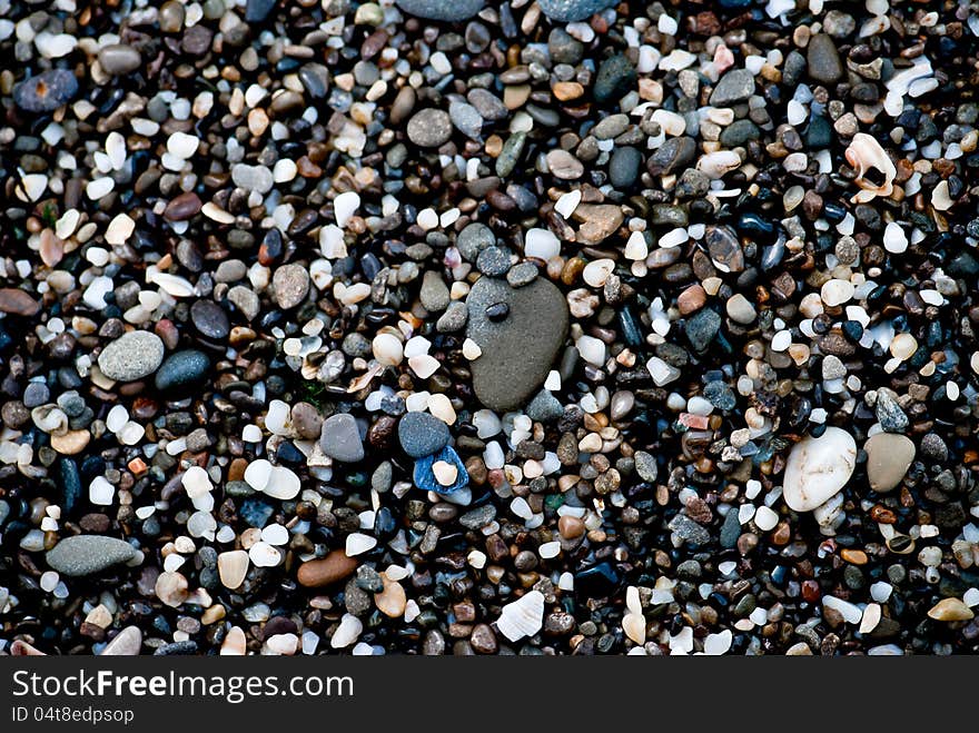 A close up view of smooth polished multicolored stones washed