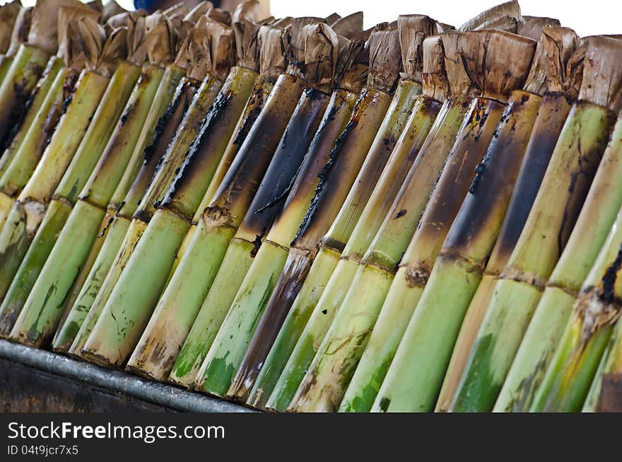 Glutinous rice roasted in bamboo joints.