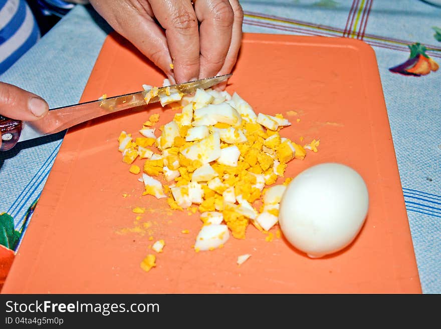 The welded eggs cut for salad. The welded eggs cut for salad