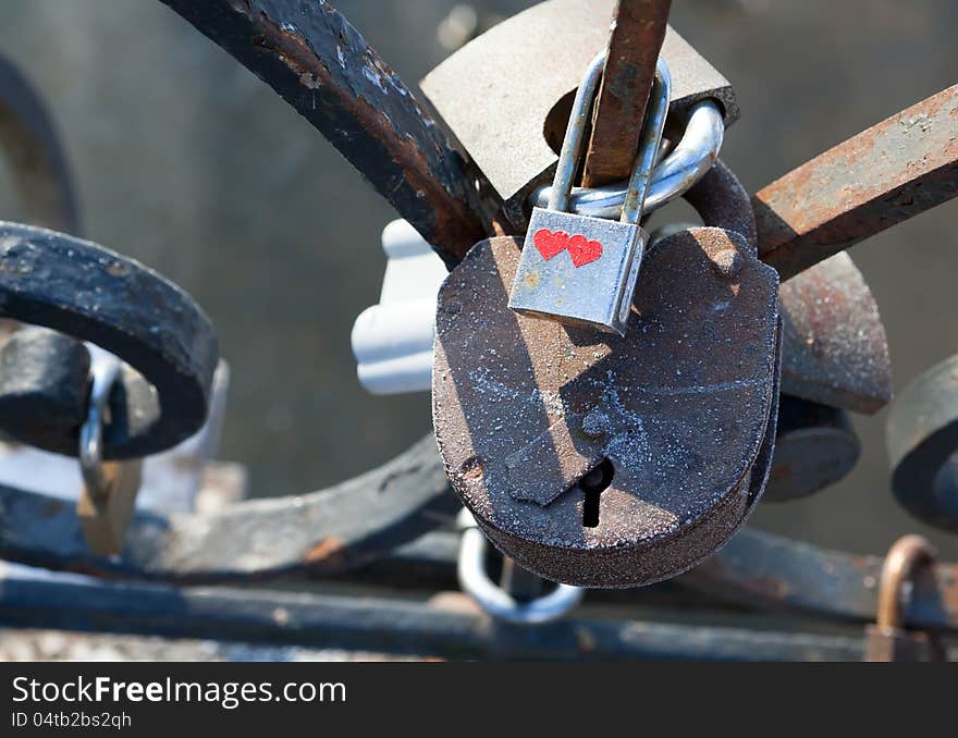 Love padlocks - symbol of eternal happiness.  Love padlocks hanging on the railing of the bridge