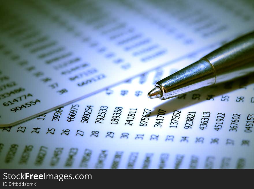 Closeup of pen on abstract number background. Closeup of pen on abstract number background