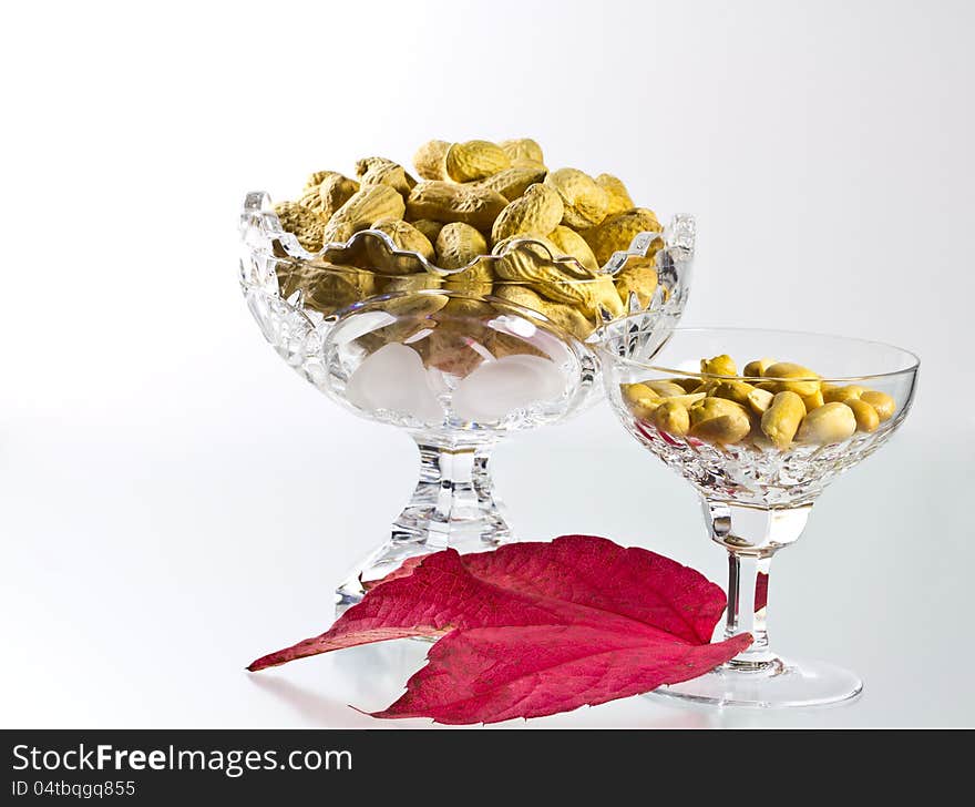 Peanuts, shelled and unshelled decorated with a wine leaf