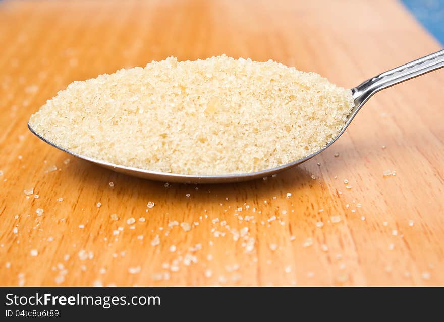 Close up cane sugar in the spoon