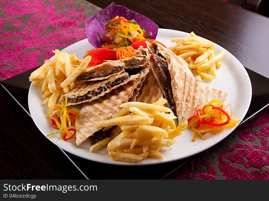 Delicious and appetizing fajitas overhead shot of Turkish beef fajitas. Delicious and appetizing fajitas overhead shot of Turkish beef fajitas