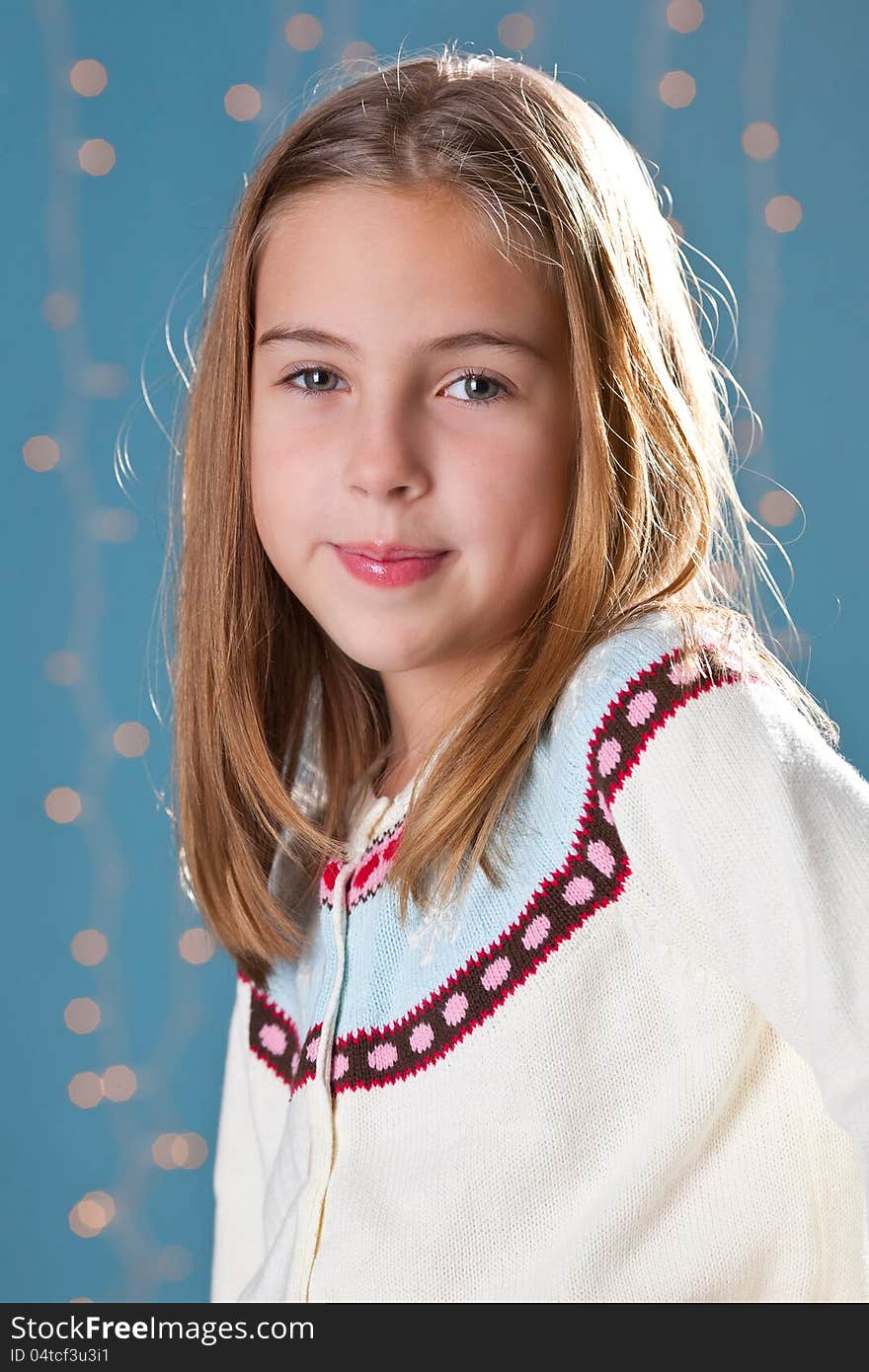 Portrait of lovely kid girl wearing winter clothing in the studio. Portrait of lovely kid girl wearing winter clothing in the studio.