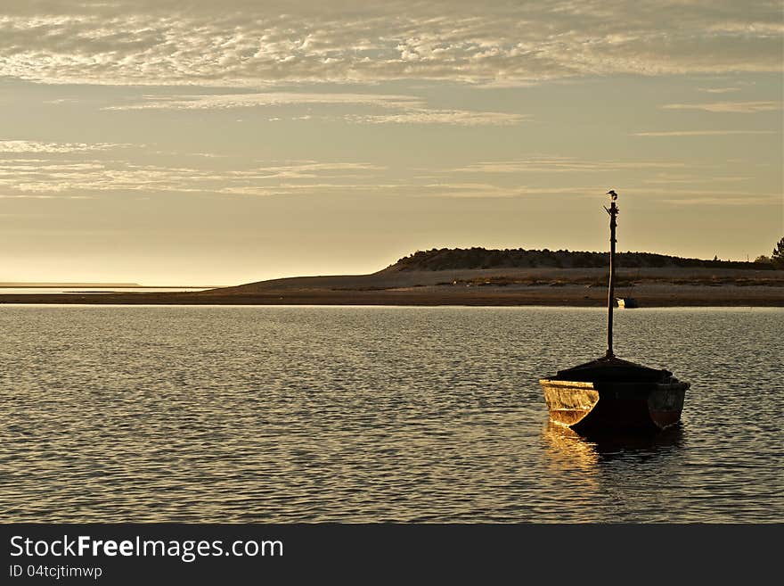 This image is from Foz-Do-Arelho, Portugal. Shows a traditional fishing port at sunset. This image is from Foz-Do-Arelho, Portugal. Shows a traditional fishing port at sunset