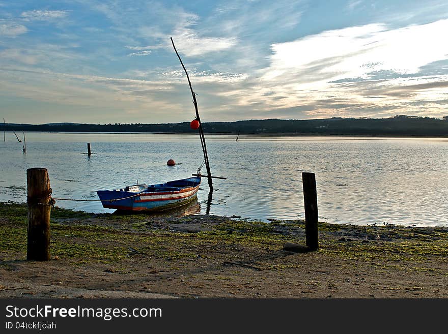 This image is from Foz-Do-Arelho, Portugal. Shows a traditional fishing port at sunset. This image is from Foz-Do-Arelho, Portugal. Shows a traditional fishing port at sunset