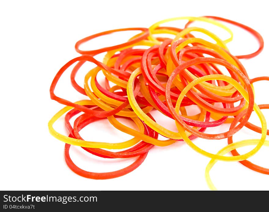 Colorful rubber bands on white background