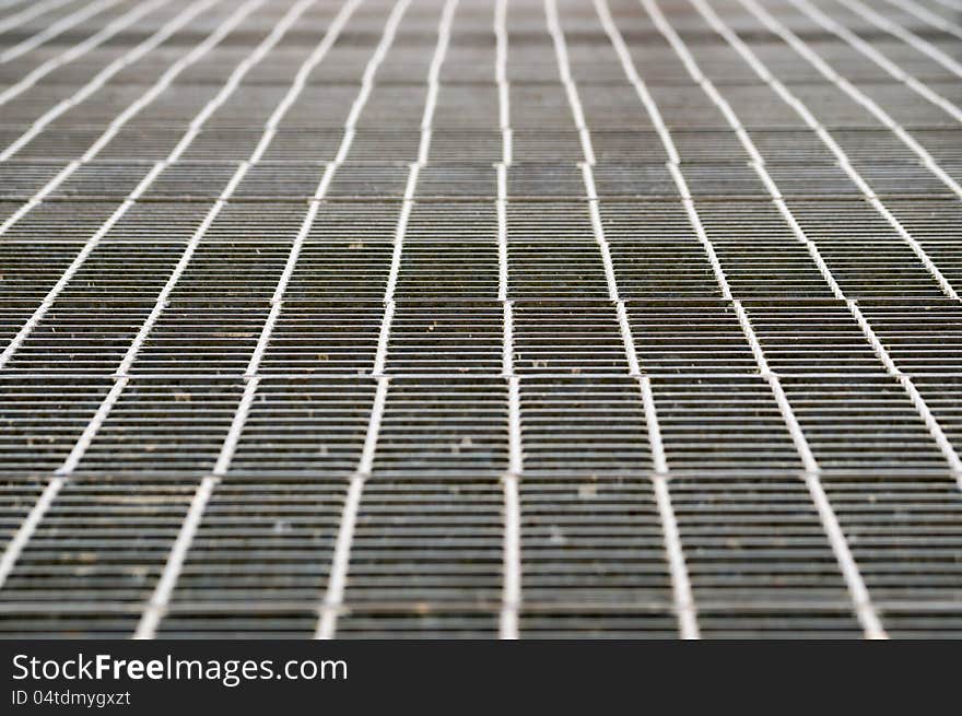 Perspective of shiny metal grill grid floor. Perspective of shiny metal grill grid floor