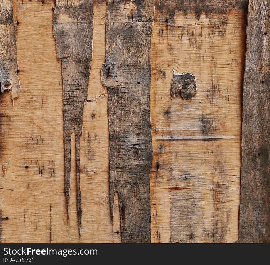 Aged plywood door fragment. May be used as texture or background. Aged plywood door fragment. May be used as texture or background