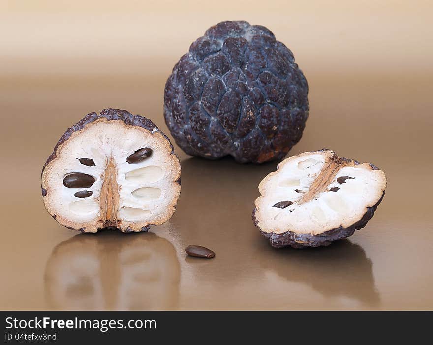 Dried custard apples on beige background. Dried custard apples on beige background.